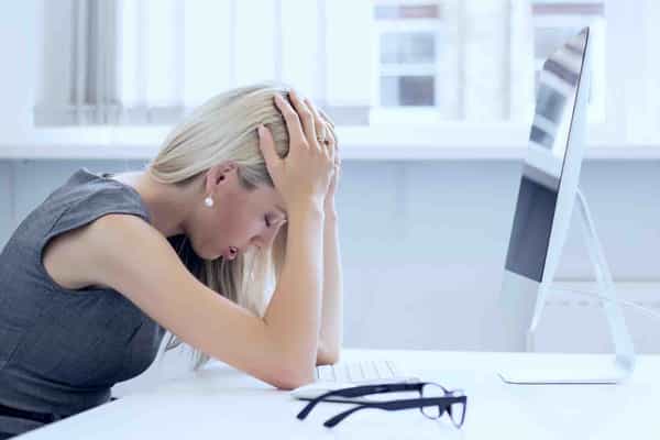 Young woman frustrated with work